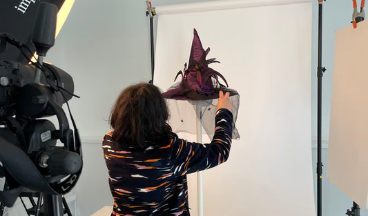 Photographing a NoBox HomePod stand on a white seamless backdrop during the studio shoot, camera rig in the foreground