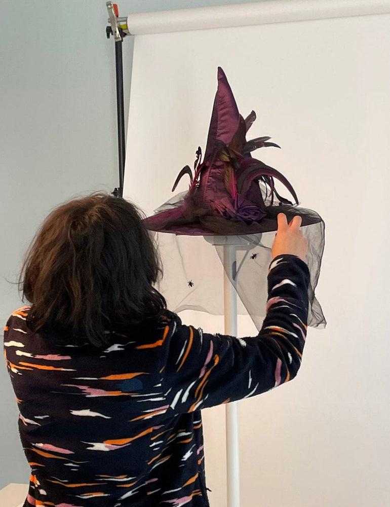 Photographing a NoBox HomePod stand on a white seamless backdrop during the studio shoot, camera rig in the foreground