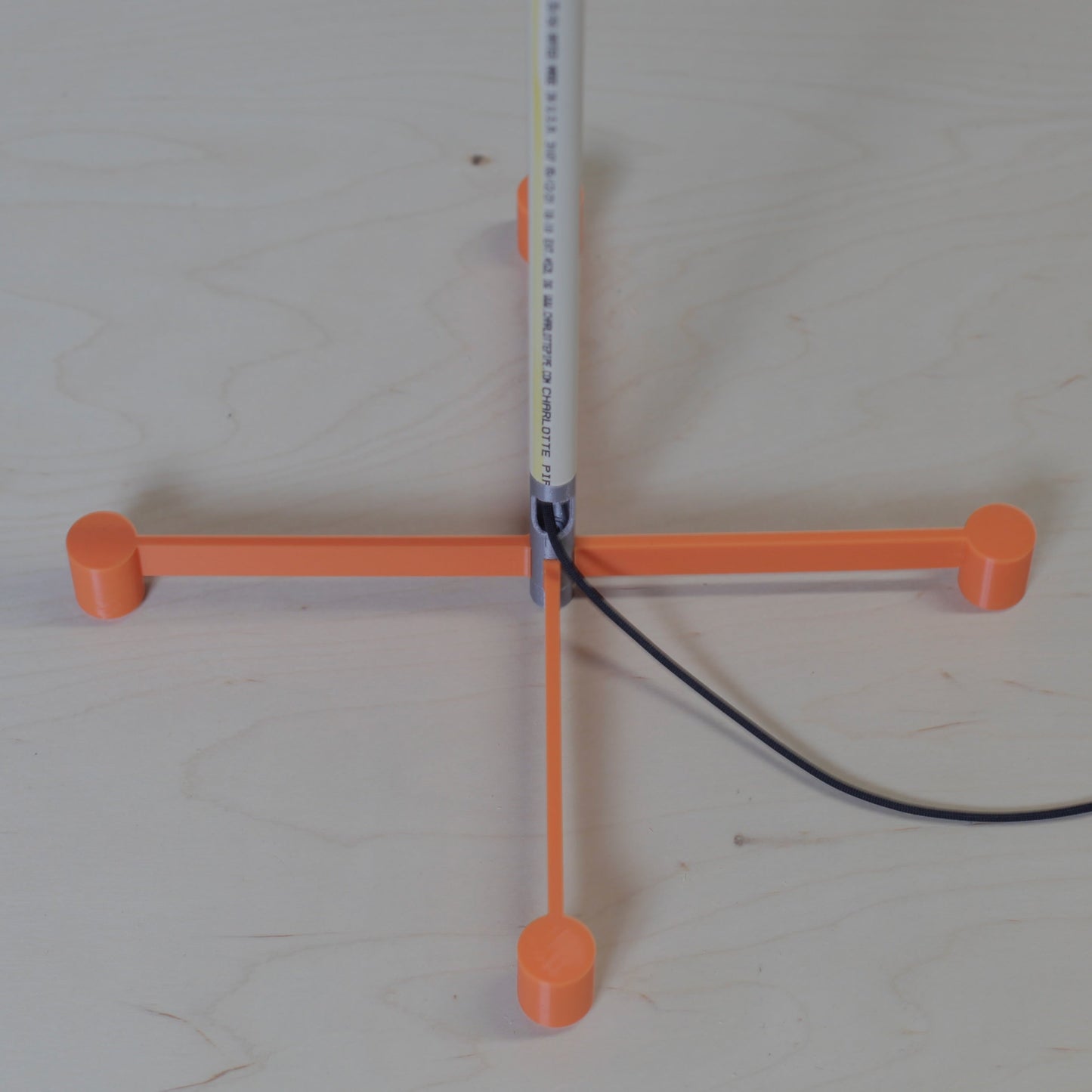 DIY HomePod mini stand showing the slender PVC pipe post
