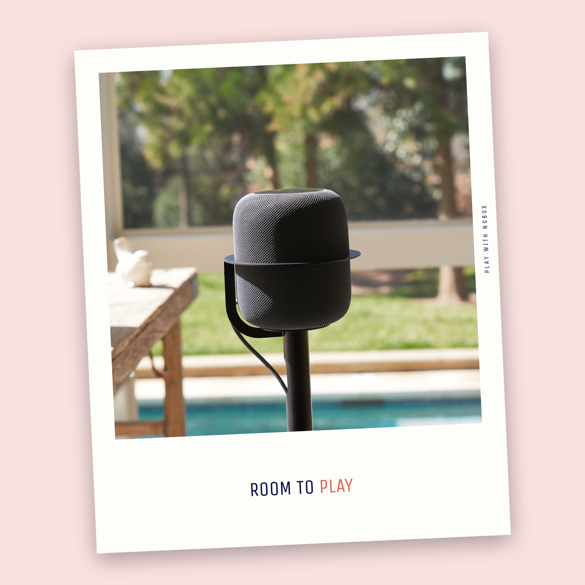 A black NoBox HomePod floor stand standing free in an open room