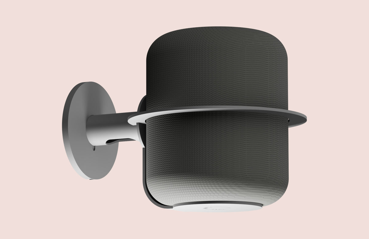 The NoBox wall mount's perch following the curve of an Apple HomePod, holding it without covering a driver or sensor