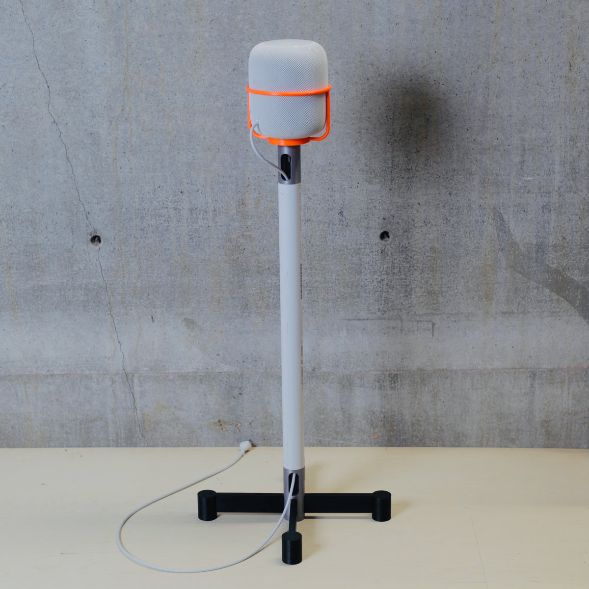 3D printed cradle holding an Apple HomePod on the DIY Classic stand